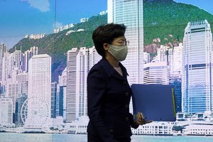 Hong Kong Chief Executive Carrie Lam arrives to attend a news conference in Hong Kong, Friday, July 31, 2020. Hong Kong leader Lam announced that the government will postpone highly anticipated legislative elections by one year, citing a worsening coronavirus outbreak in the semi-autonomous Chinese city.