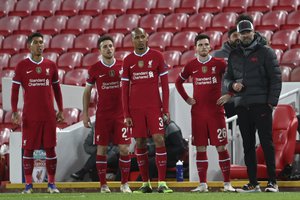 Liverpool's Roberto Firmino, Diogo Jota, Fabinho and Andrew Robertson, from left to right uring the Champions League group D soccer match between Liverpool and Atalanta at Anfield stadium