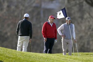 President Donald Trump plays golf at Trump National Golf Club, Saturday, Nov. 28, 2020, in Sterling, Va.