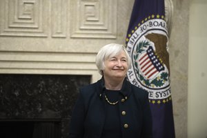 File - Janet L. Yellen smiles after being sworn in as Chair of the Board of Governors of the Federal Reserve System. The swearing-in took place at the Marriner S. Eccles Federal Reserve Board Building in Washington, D.C., on February 3, 2014.