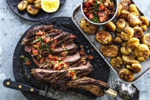 Grilled aged rib-eye with tomato, almond and chilli salsa.