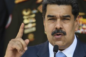 In this March 12, 2020 file photo, Venezuelan President Nicolas Maduro gives a press conference at Miraflores presidential palace in Caracas, Venezuela.