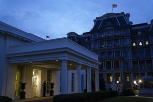 In this Nov. 25, 2020, file photo a Marine stands outside the entrance to the West Wing of the White House, signifying that President Donald Trump is in the Oval Office in Washington.