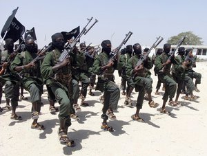 In this Thursday, Feb. 17, 2011 file photo, hundreds of newly trained al-Shabab fighters perform military exercises in the Lafofe area some 18 km south of Mogadishu, in Somalia.