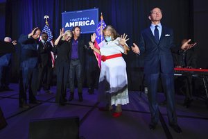 In this Thursday, July 23, 2020 file photo, from right, Ralph Reed, Dr. Alveda King, Journey keyboardist Jonathan Cain, and personal pastor to the president, Paula White Cain, and others pray on stage during a Donald Trump campaign event courting devout conservatives by combining praise, prayer and patriotism in Alpharetta, Georgia.