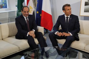 French President Emmanuel Macron, right, meets Egyptian President Abdel-Fattah el-Sissi during bilateral talks Monday, Aug. 26, 2019 in Biarritz, southwestern France.