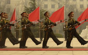 File - Members of a Chinese military honor guard march during a welcome ceremony for Chairman of the Joint Chiefs of Staff Marine Gen. Peter Pace at the Ministry of Defense in Beijing, China, March 22, 2007.