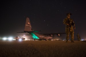 A fly-away security team from the 1st Battalion, 153rd Infantry Regiment provides security for a C-130J, May 26, 2017, during a cargo mission in Somalia, supporting the Combined Joint Task Force-Horn of Africa