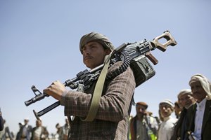 A Shiite Houthi tribesman holds his weapon during a tribal gathering showing support for the Houthi movement, in Sanaa, Yemen, Saturday Sept. 21, 2019.