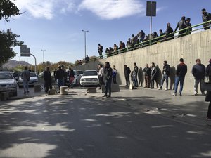 Demonstrators block a street during a protest after authorities raised gasoline prices, in the central city of Isfahan, Iran, Saturday, Nov. 16, 2019