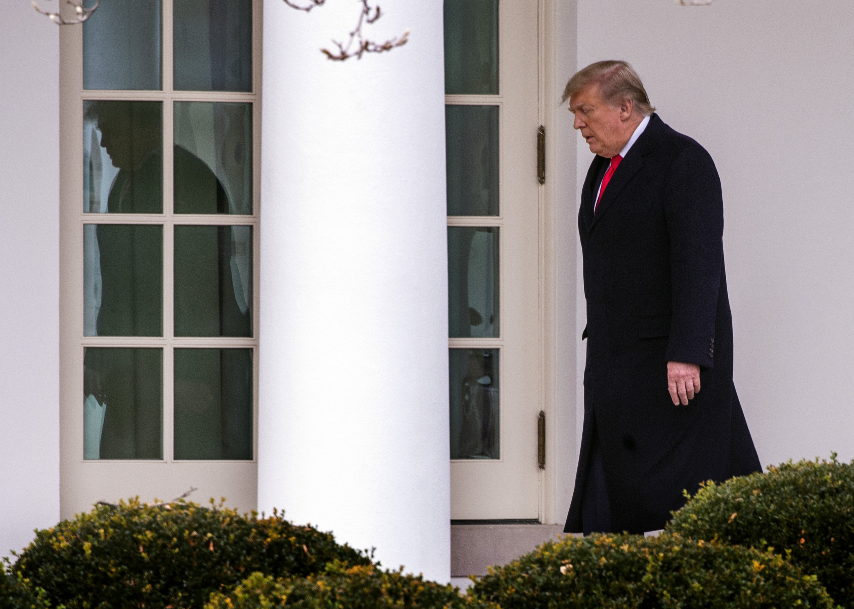 The President and First Lady arrive on the South Lawn of the White House after returning from Florida, on December 31 in Washington, DC.