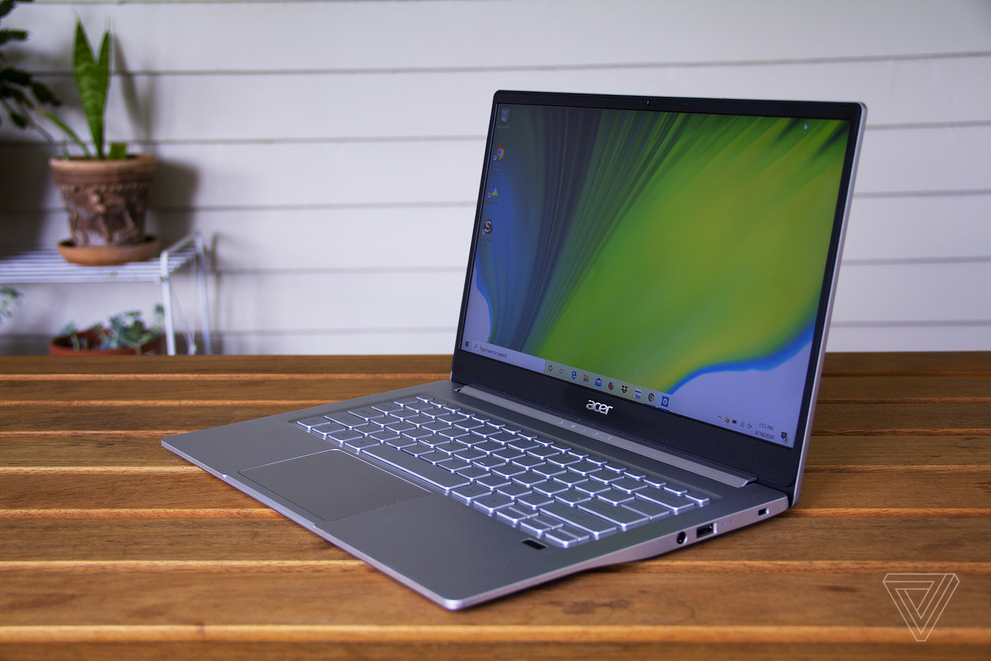 The Acer Swift 3 sits on a table.