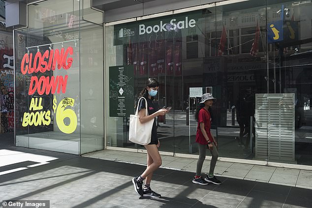 A month after the October 6 budget, national retail sales boomed, rising by 7.1 per cent in November following the end of Melbourne's three-month lockdown. Pictured are shoppers in Melbourne