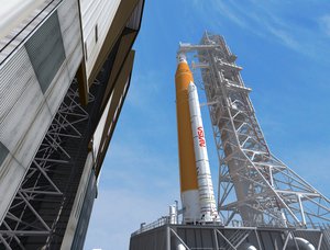 File - The NASA logotype, or "worm" logo, is seen on a booster on the side of NASA's Space Launch System, which will power the Artemis I mission into space.