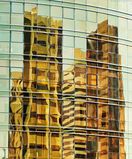 Reflections on a Yellow Glass Facade, Abu Dhabi