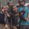 Families grieve as the body of a relative is recovered from the rubble. 