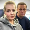 Alexei Navalny and Yulia on board their flight to Moscow.