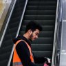 A cleaner disinfects public transport. The Train station that connects to the bus staion at Bondi Junction.. Coronavirus, 24th May 2020. Photo: Edwina Pickles / SMH