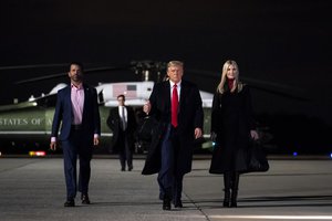 Donald J. Trump walks with Presidential Advisor Ivanka Trump and his son Donald J. Trump Jr. to board Air Force One at Dobbins Air Reserve Base in Marietta, Ga. Tuesday, Jan. 4, 2021