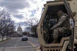 A member of the National Guard secures the U.S. Capitol ahead of the inauguration of President-elect Joe Biden and Vice President-elect Kamala Harris in Washington, Sunday, Jan. 17, 2021.