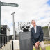 Neale Daniher poses next to the sign marking Daniher's Way.