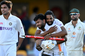 Rishabh Pant celebrates victory with his teammates.