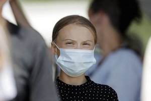 Climate activist Greta Thunberg arrives for a news conference following a meeting with German Chancellor Angela Merkel in Berlin, Germany, Thursday, Aug. 20, 2020