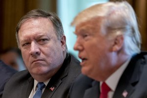 President Donald Trump, accompanied by Secretary of State Mike Pompeo, left, speaks during a cabinet meeting in the Cabinet Room of the White House, Thursday, Aug. 16, 2018, in Washington.