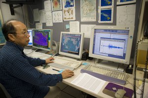 Dr. Vindell Hus reviews earthquake and tsunami data at the Pacific Tsunami Warning Center, Saturday, Feb. 27, 2010 in Ewa Beach, Hawaii.