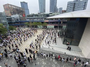 Apple fans line up to visit a new flagship store opened at Sanlitun in Beijing, China on Friday, July 17, 2020.