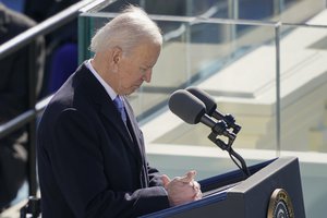 President Joe Biden bows his head to pray as he speaks during the 59th Presidential Inauguration at the U.S. Capitol in Washington, Wednesday, Jan. 20, 2021.