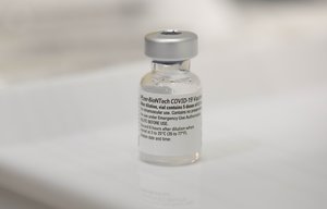 A vial with the Pfizer-BioNTech Covid-19 disease vaccine and syringes at the corona vaccination centre at the Robert Bosch hospital in Stuttgart, Germany