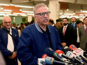 Pakistan's President Arif Alvi talks to journalists prior to departing to Turkey on a three-day visit, in Islamabad, Pakistan, Oct. 28, 2018. 