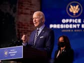 President-elect Joe Biden speaks at The Queen theater, Monday, Dec. 28, 2020, in Wilmington, Del. Vice President-elect Kamala Harris listens at right.