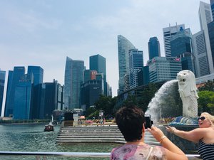 Tourists taking photos at the Merlion Park in Singapore. Taken on September 2018.