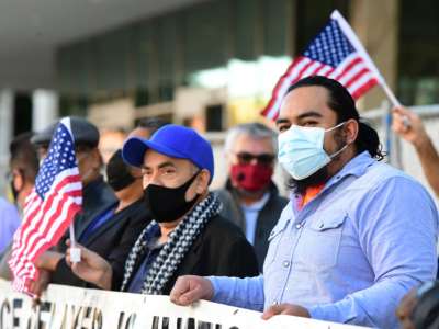 Immigrant rights groups call on the incoming Biden/Harris administration to establish a cut-off date for new comprehensive immigration reform and reverse the xenophobic climate created in the last four years during a rally outside the Federal Building in Los Angeles, California, on January 14, 2021.