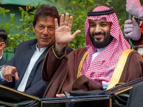 Pakistan's Prime Minister Imran Khan and Saudi Crown Prince Mohammed Bin Salman riding in a carriage during a welcome ceremony in Islamabad. February 18, 2019