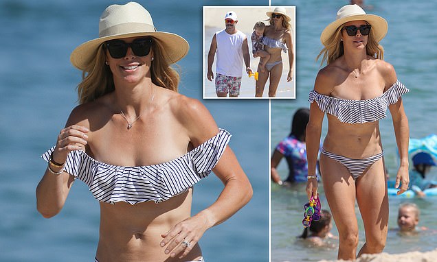 WAG Candice Warner flaunts her sensational figure in skimpy bikini