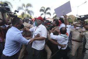 India police stop protesting farmers as they march in Mumbai, India, Monday, Jan. 25, 2021