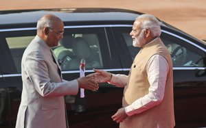 Indian Prime Minister Narendra Modi, right, wishes Indian President Ram Nath Kovind on his 73rd birthday in New Delhi, India, Monday, Oct. 1, 2018.