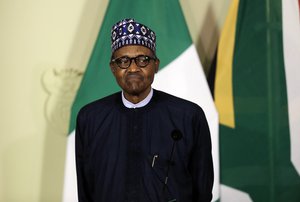 Nigerian President Muhammadu Buhari attends a press briefing after meeting with South African President Cyril Ramaphosa in Pretoria, South Africa Thursday, Oct. 3, 2019