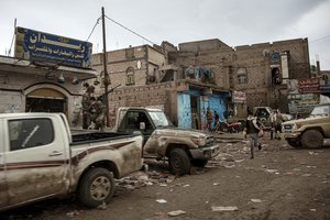 In this Aug. 4, 2019 photo, Yemenis make their way on a road in Dhale province, an active frontline between militiamen backed by the Saudi-led coalition and Houthi rebels, where African migrants cross to continue their journey in Yemen