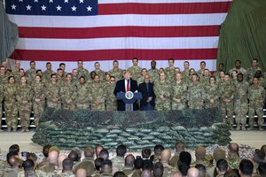 File - President of the United States Donald J. Trump and Army Gen. Mark A. Milley, chairman of the Joint Chiefs of Staff, meet with service members at Bagram Airfield in Afghanistan, Nov. 28, 2019.