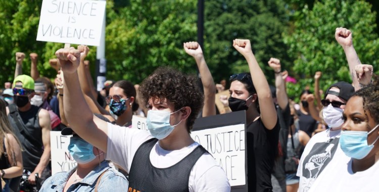 a group of black lives matter protesters, black people at the front