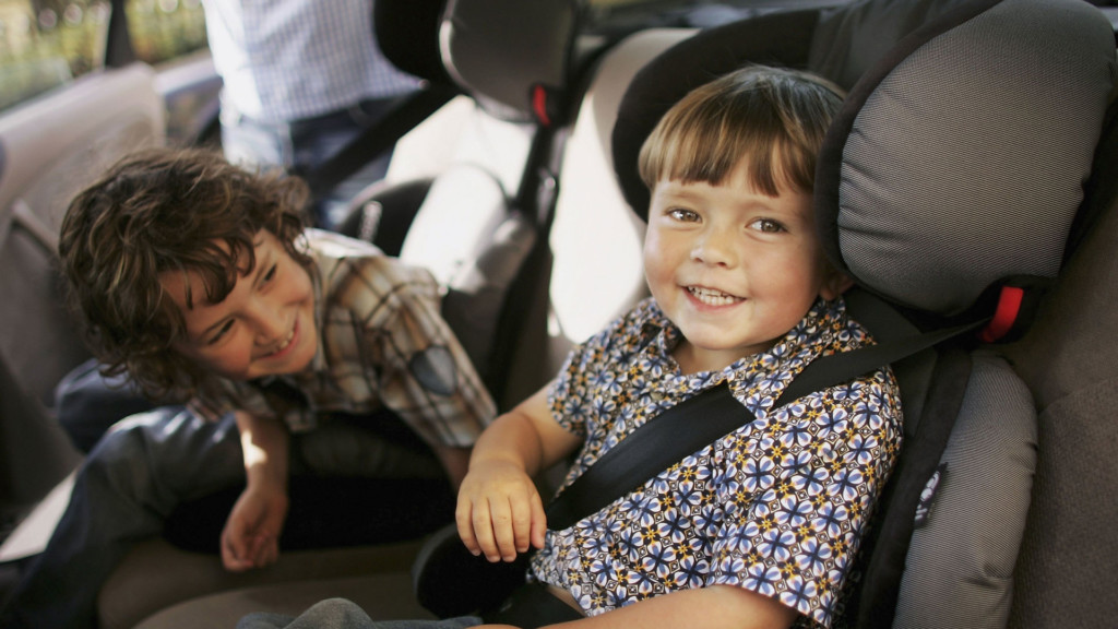 Children sit in booster seats