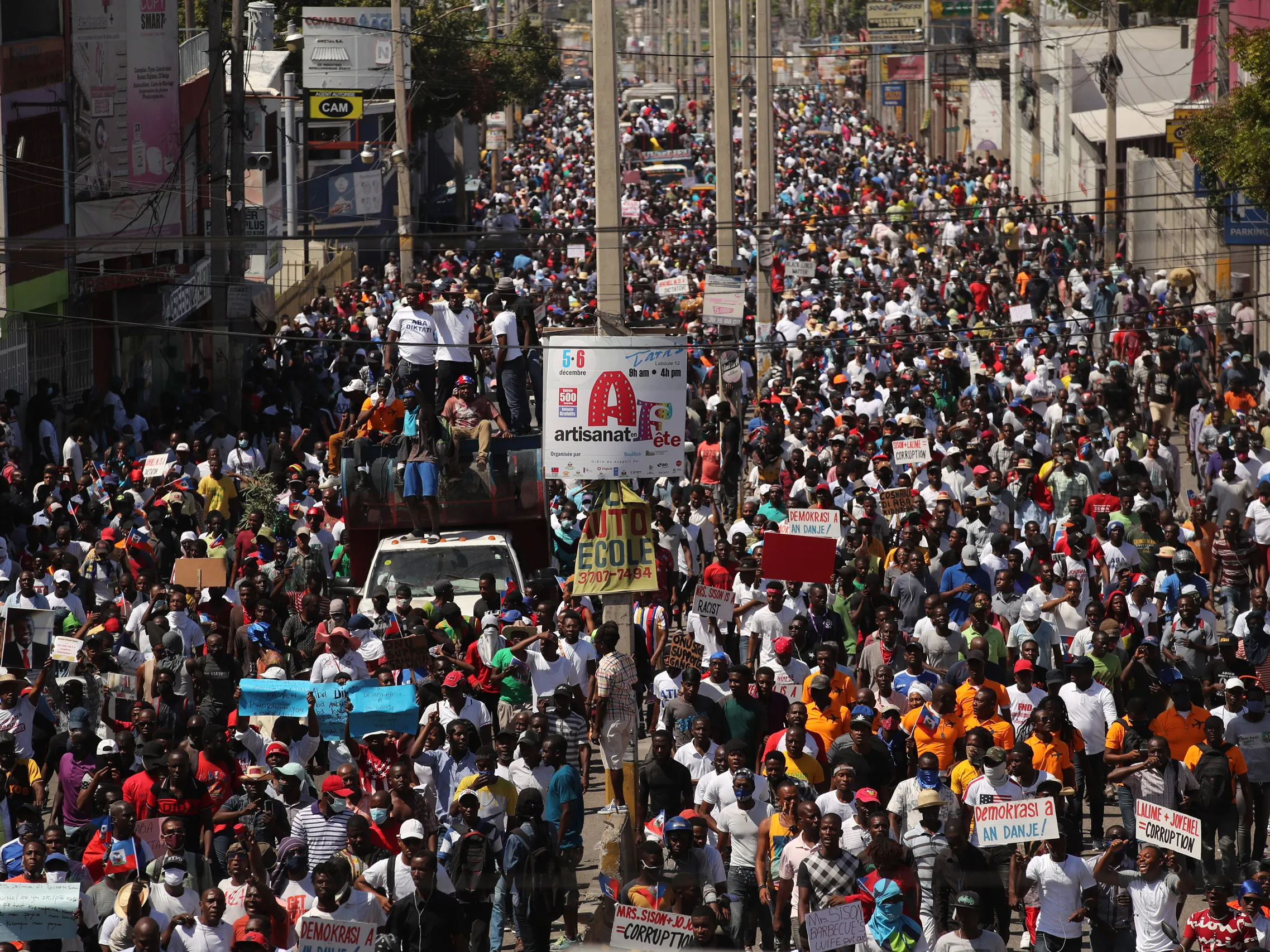 A large group of people protesting in PortauPrince Haiti