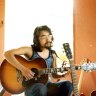 Kazuo Ishiguro playing guitar in the British summer of 1977 in Broad Oak, Kent. 