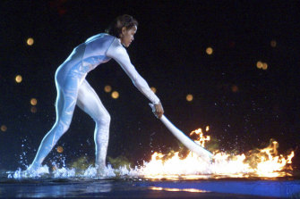 Cathy Freeman ignites the Olympic flame in 2000 ... and her words lit the fire for the Brisbane bid for 2032.