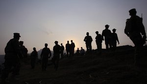 In this Oct. 1, 2016 file photo, Pakistan army soldiers gather at a forward area post on the Line of Control, that divides Kashmir between Pakistan and India, in Tatta Pani, some 123 miles, 199 km, from Islamabad, Pakistan