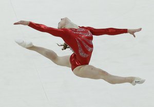 Gymnast Jennifer Pinches from Great Britain performs on the floor during the Artistic Gymnastic women's qualifications at the 2012 Summer Olympics, Sunday, July 29, 2012, in London.